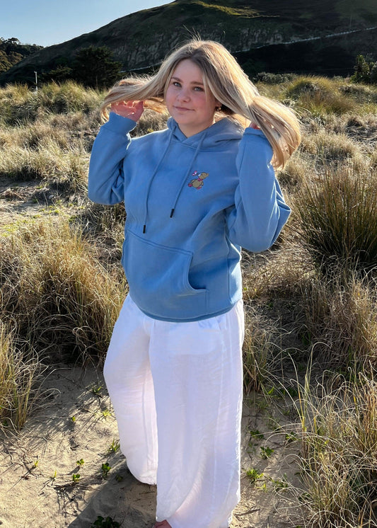 Unisex hoodie in a soft Lilac Blue color, perfect for a casual, cozy look. The BabyBearCollection hoodie offers a relaxed fit with a kangaroo pocket and adjustable hood.