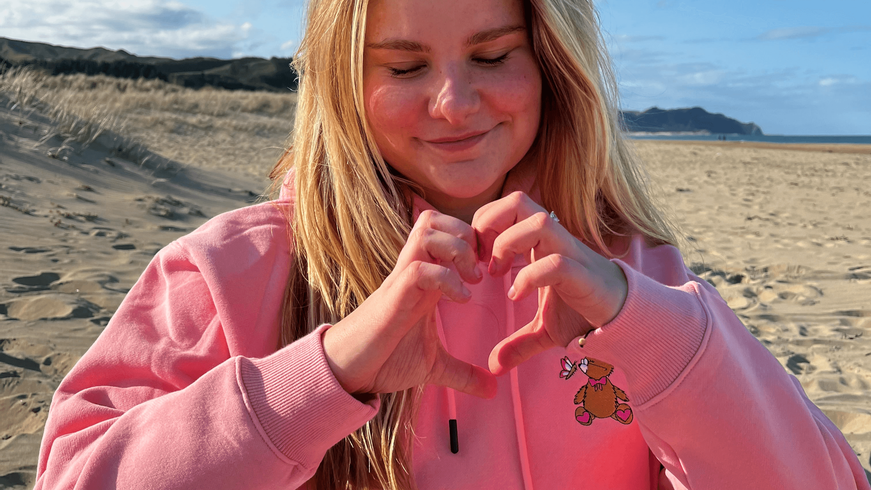 Girl Wearing a women's hoodie in pink